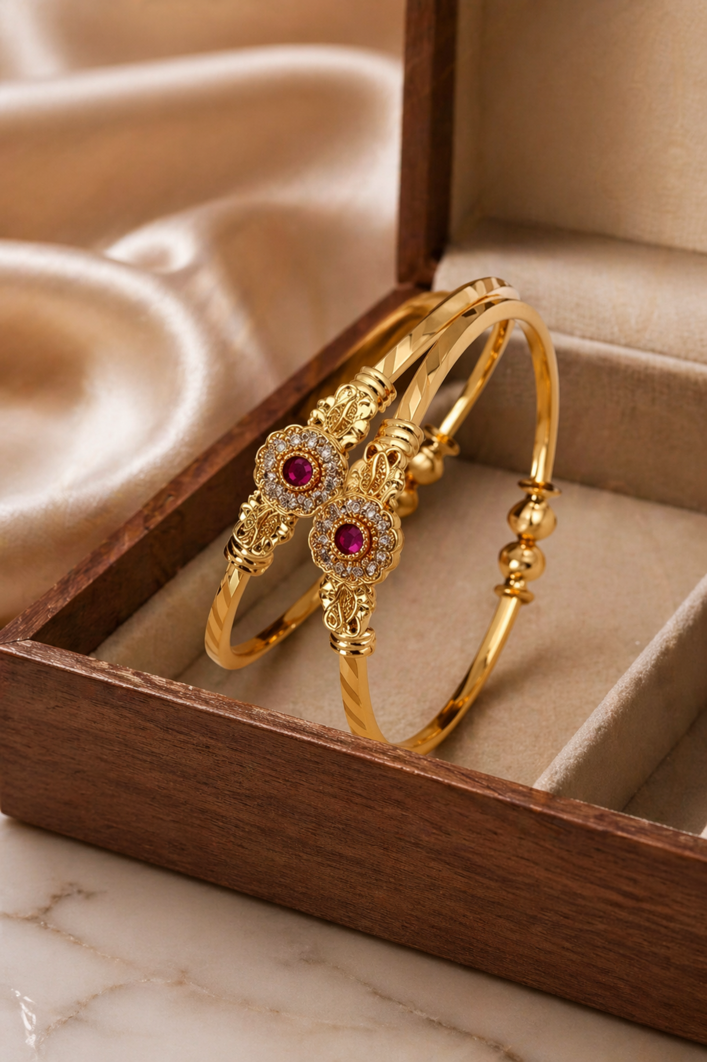 stacked gold bangles with mixed design elements
