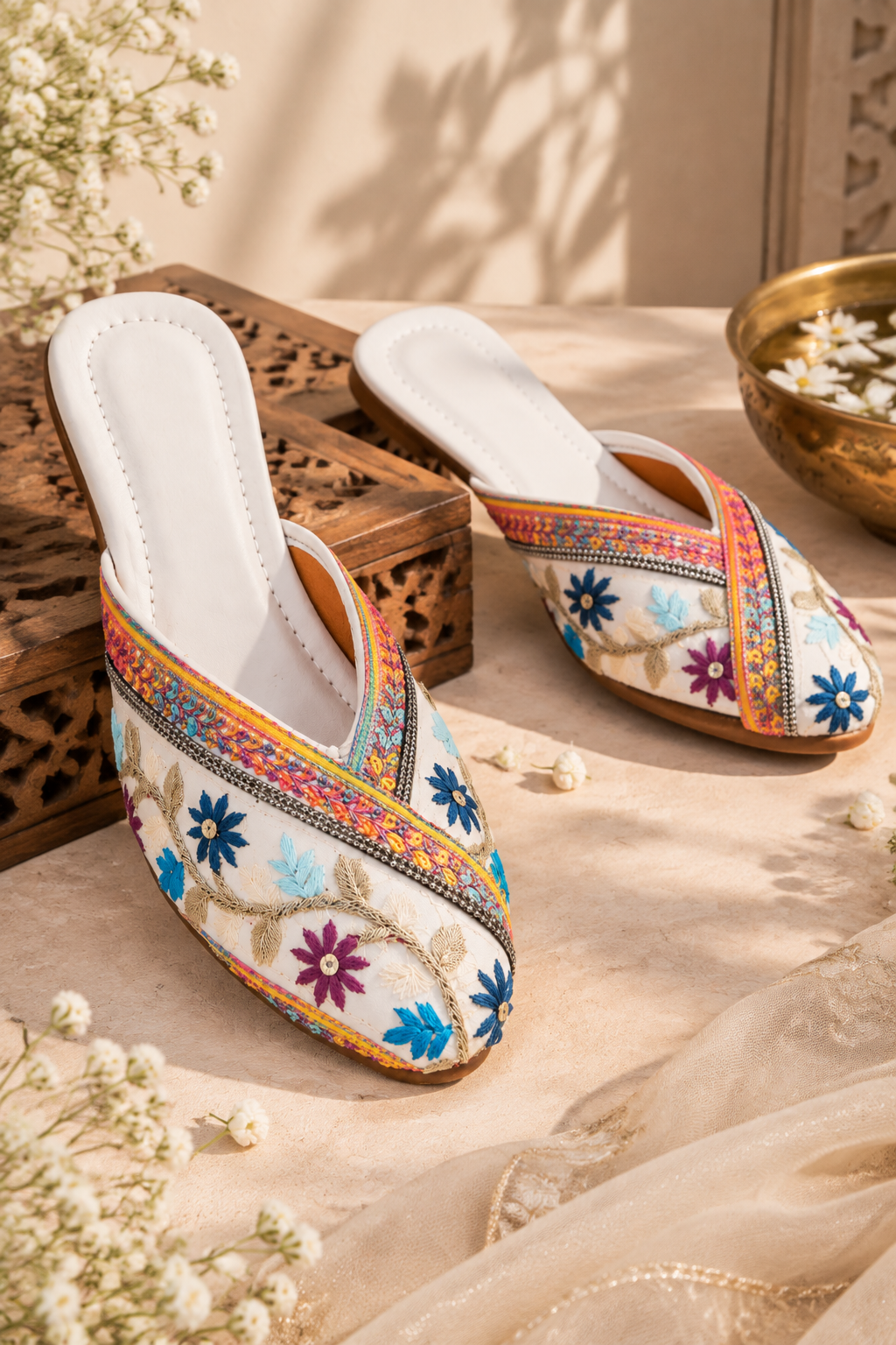 Floral embroidered Indian jutti style mojri displayed from top view