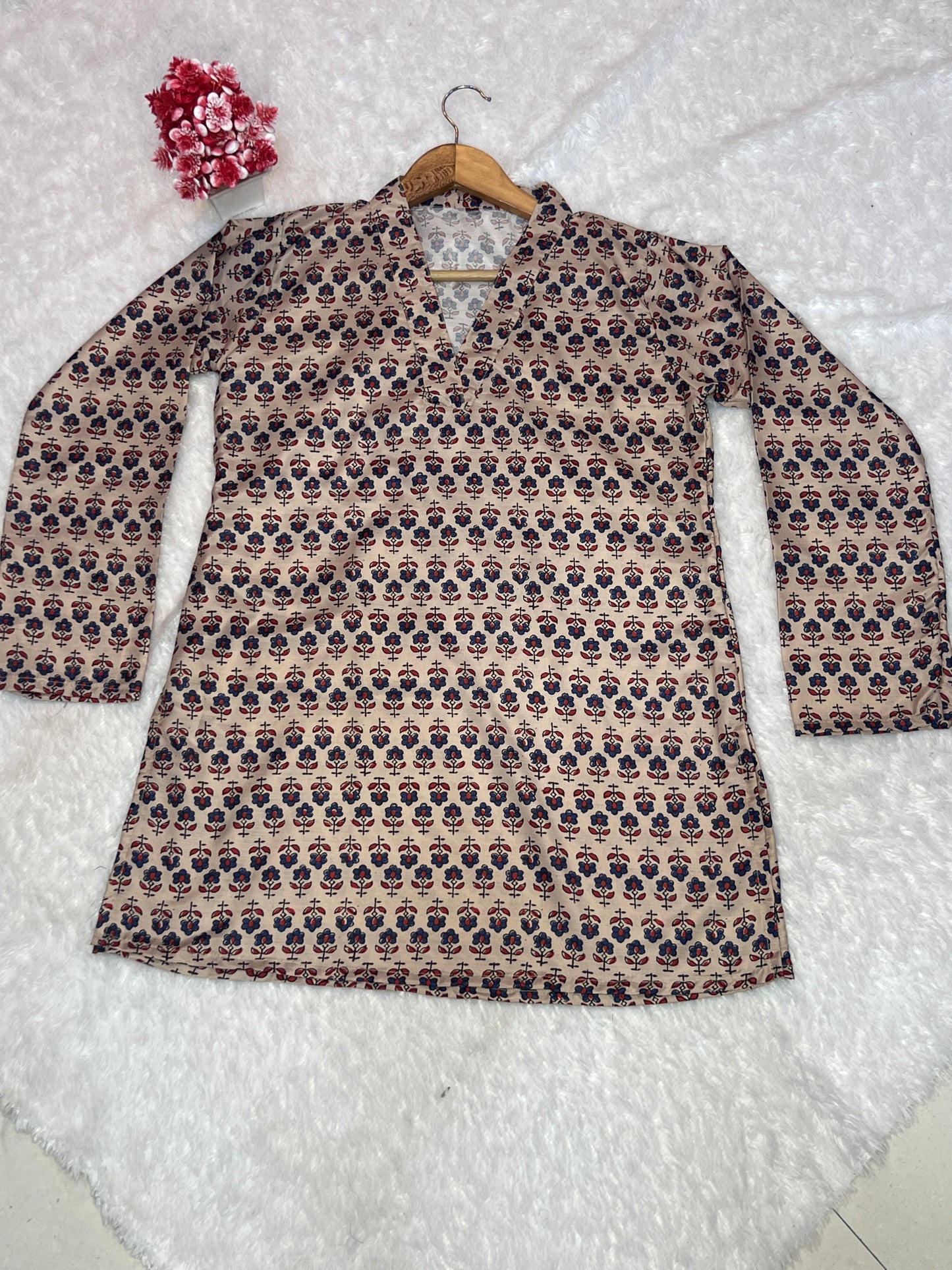 beige digital print top styled in relaxed home setting