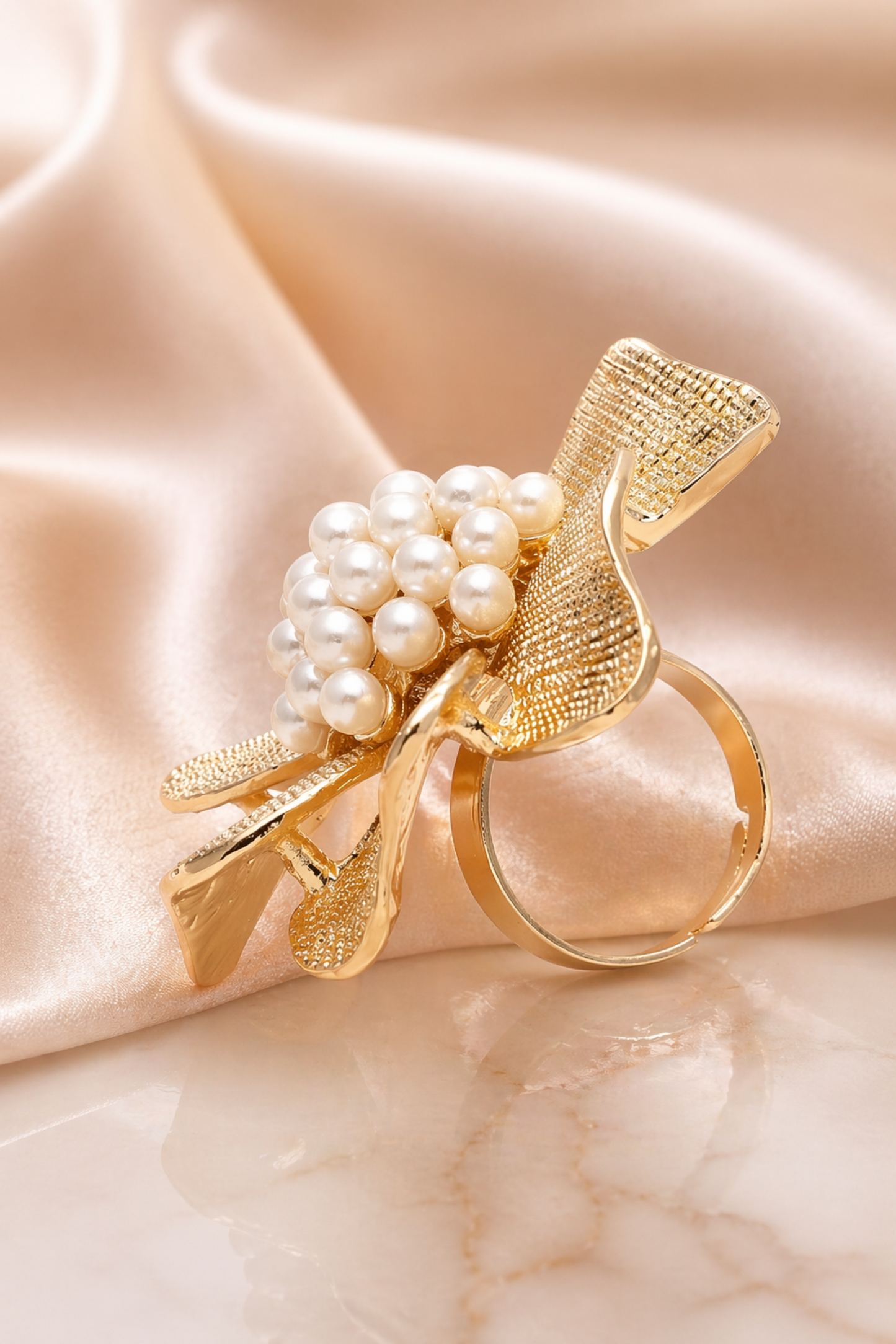 luxury gold pearl ring on hand model