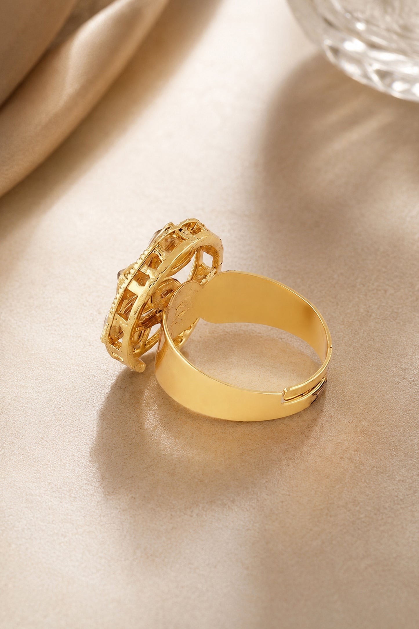 Detail view of layered floral necklace with pearl-like bead edging and polished gold-tone finish