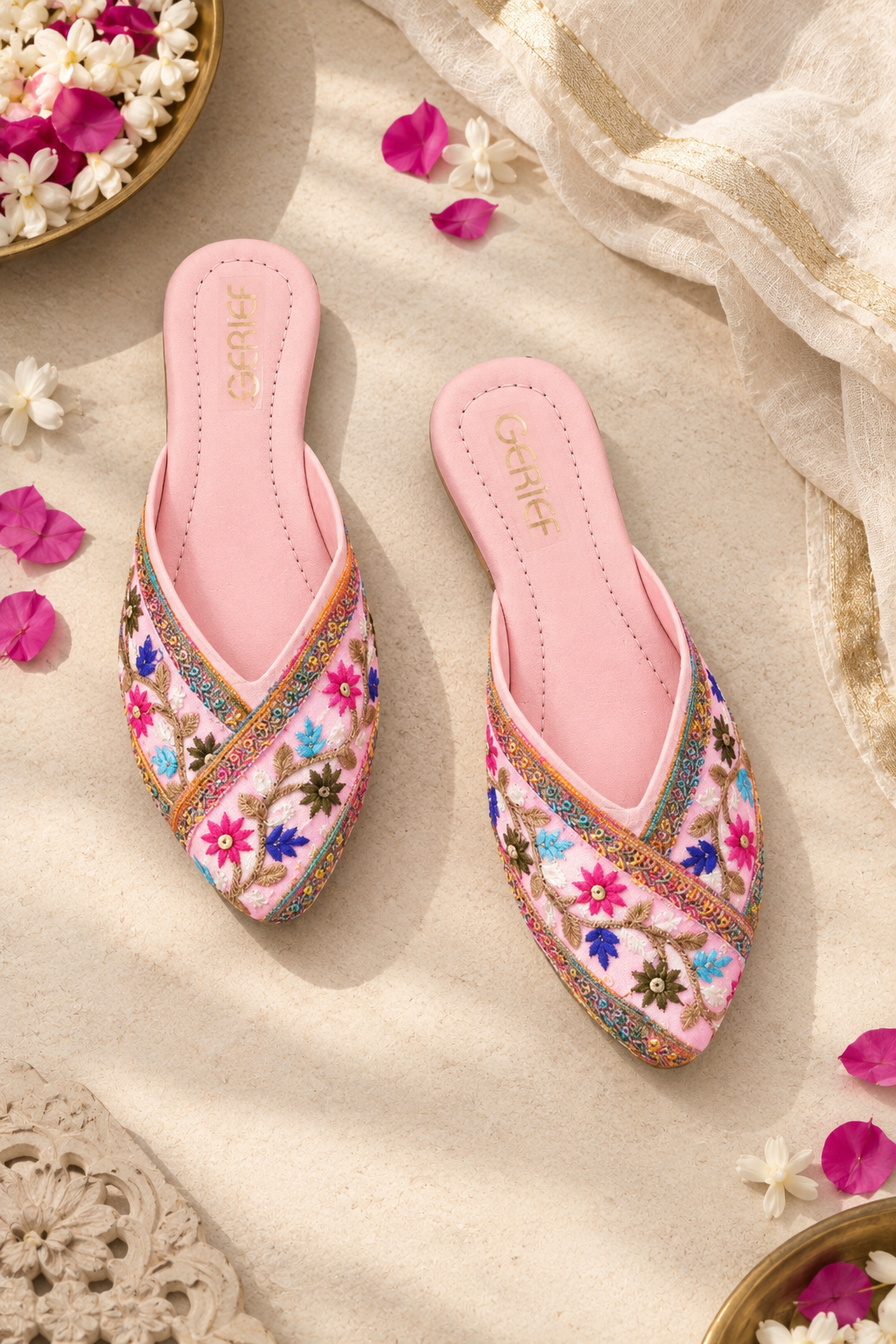 Close view of pink embroidered ethnic footwear