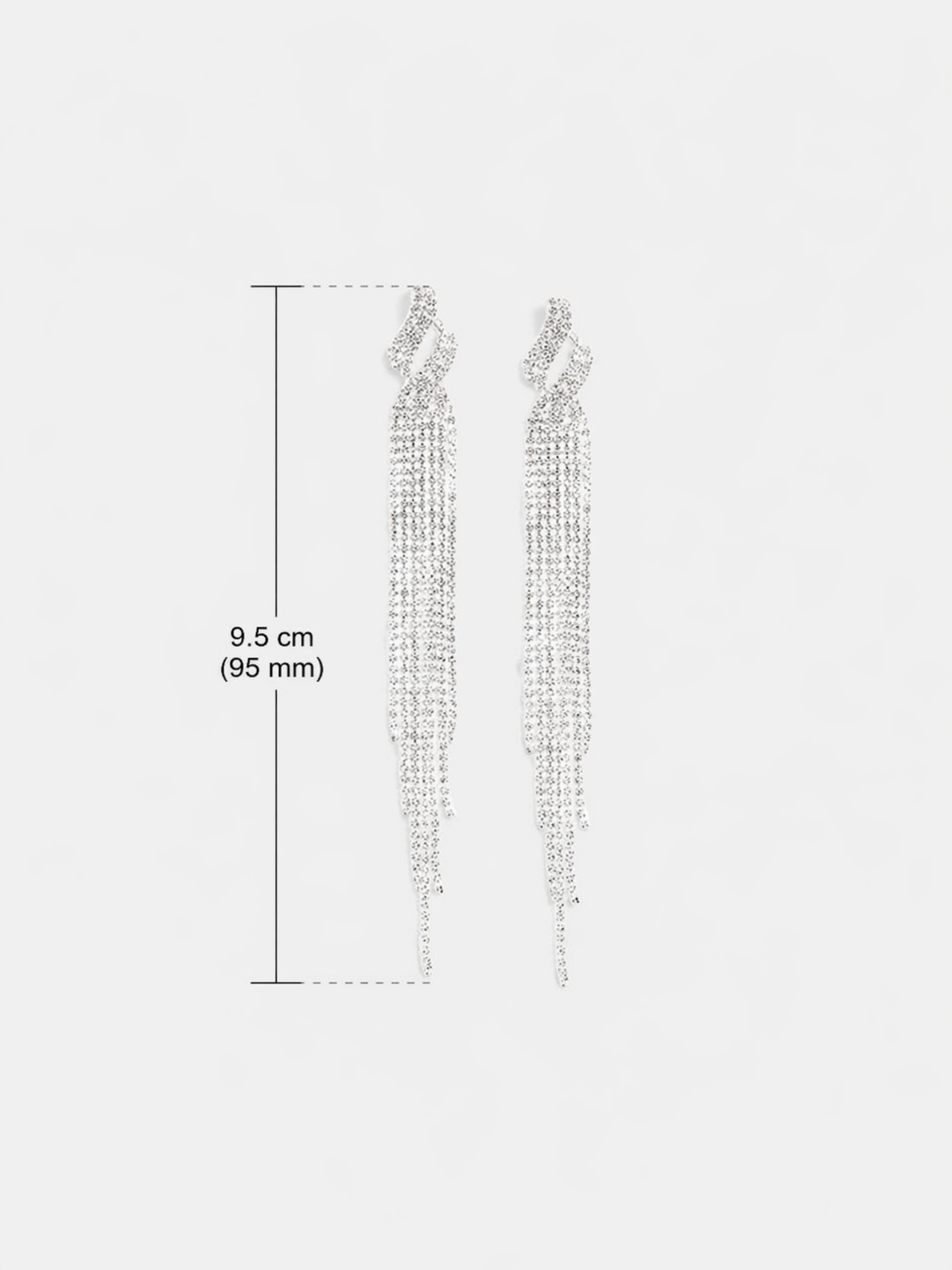 crystal tassel earrings flat lay