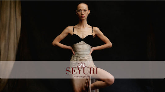 Elegant minimalist dress outfit on model with dark background, luxury fashion look 2026