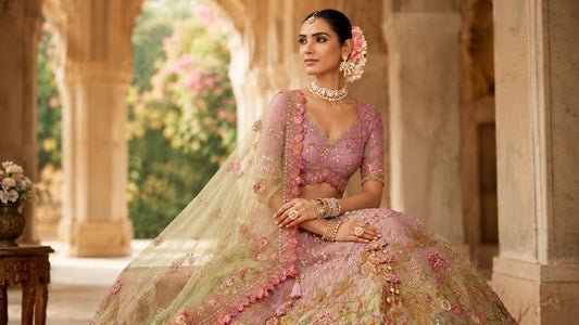 Quite Luxury pastel bridal lehenga with floral embroidery in royal palace setting for Indian wedding fashion blog cover