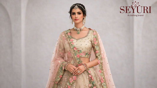 Model wearing embroidered designer lehenga with floral dupatta showcasing modern Indian ethnic fashion