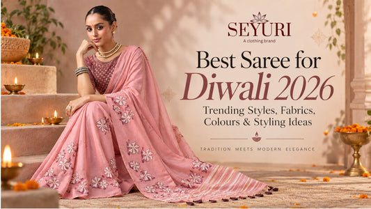 Best saree for Diwali 2026 featuring a woman in an elegant pink embroidered saree with festive styling and glowing diyas.