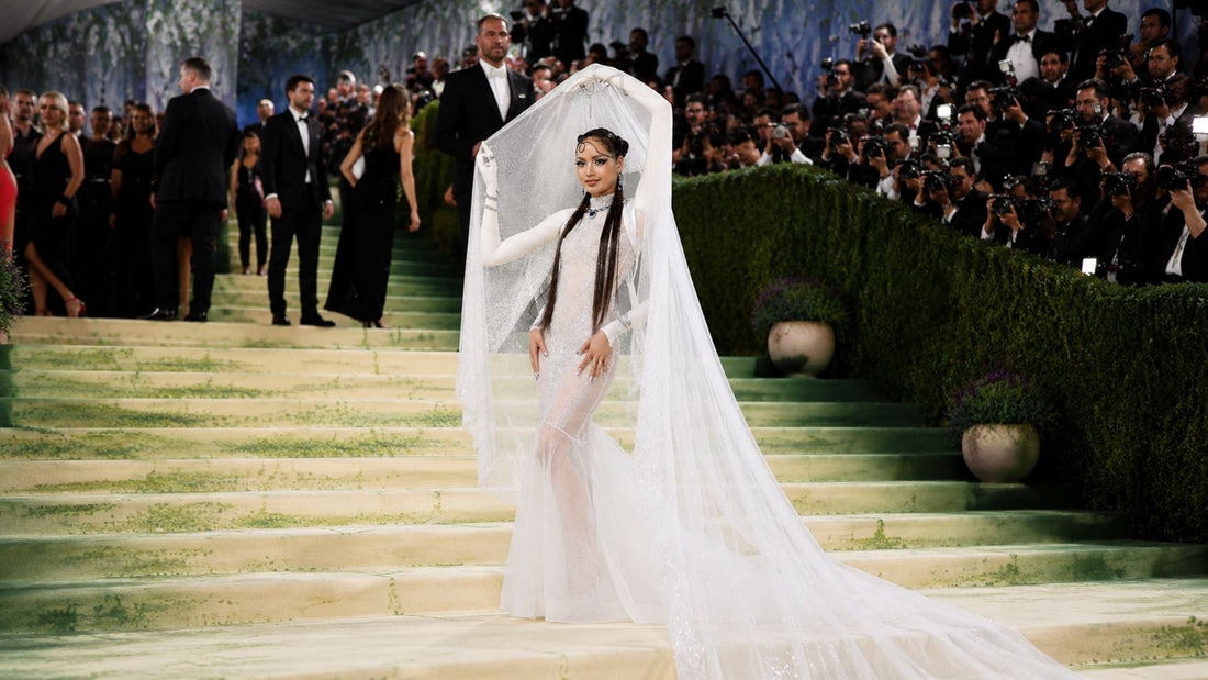 Lisa in sparkling white couture veil gown at Met Gala 2026 red carpet with dramatic editorial styling and crystal embellishments