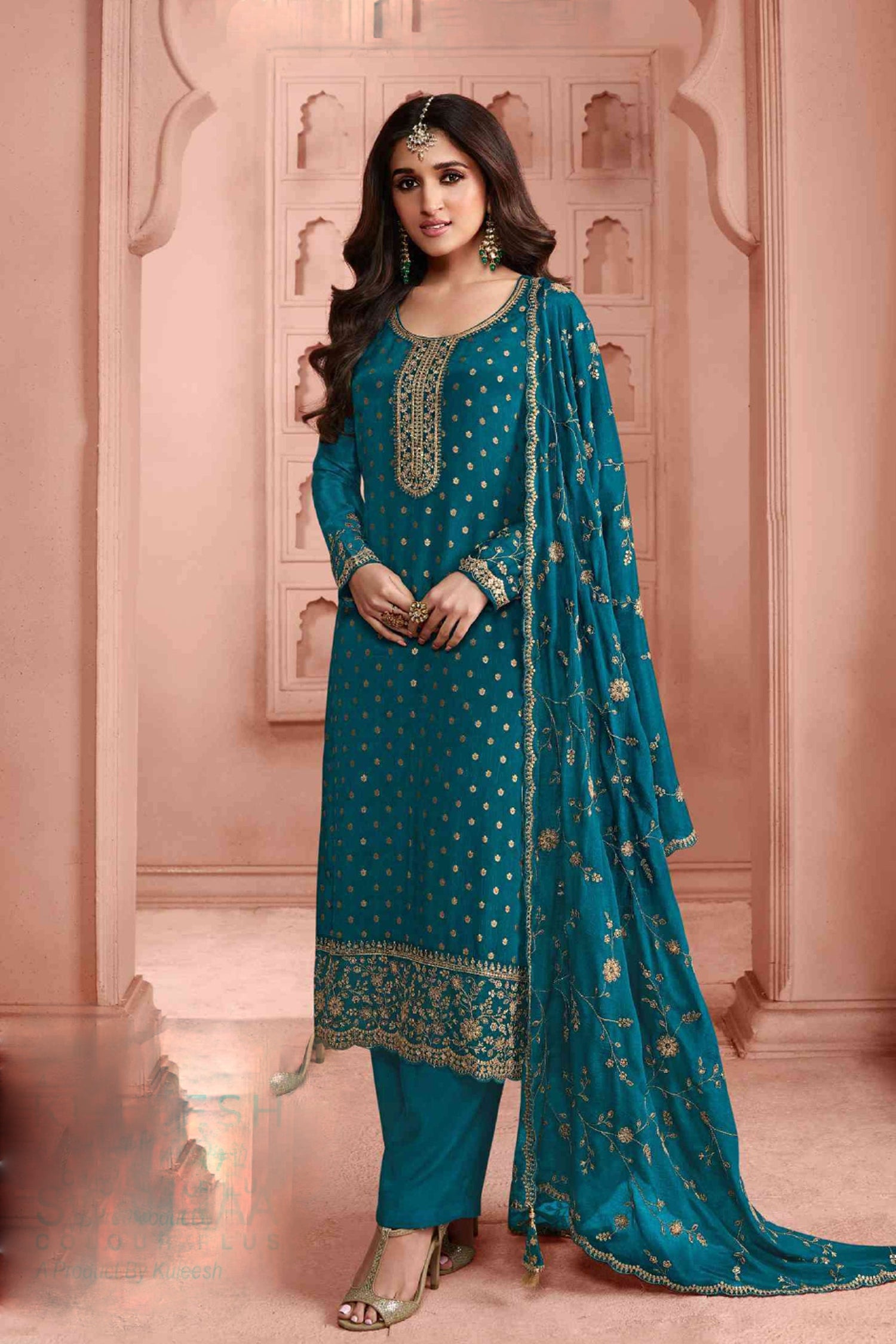 Teal Dola Jacquard salwar kameez with embroidery detailing