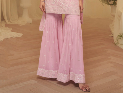 Baby pink sharara outfit styled for wedding reception USA