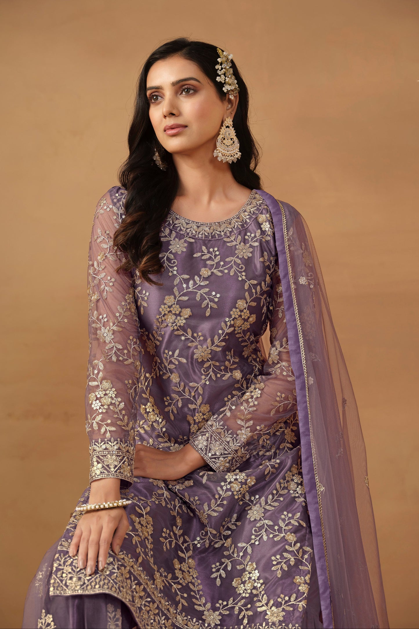 Net fabric sharara suit with elegant embroidery finish