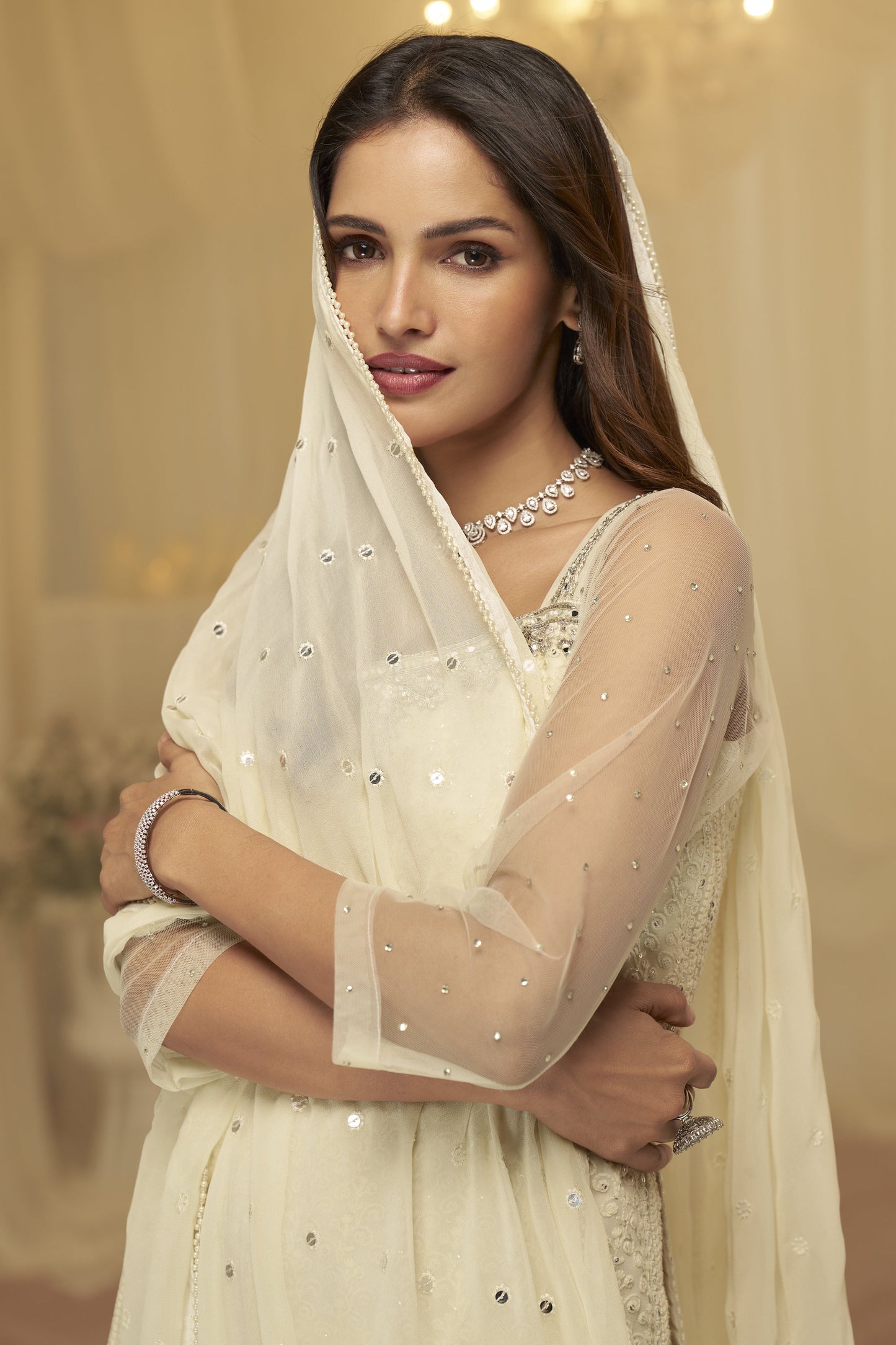Full-length beige salwar kameez suits with soft drape
