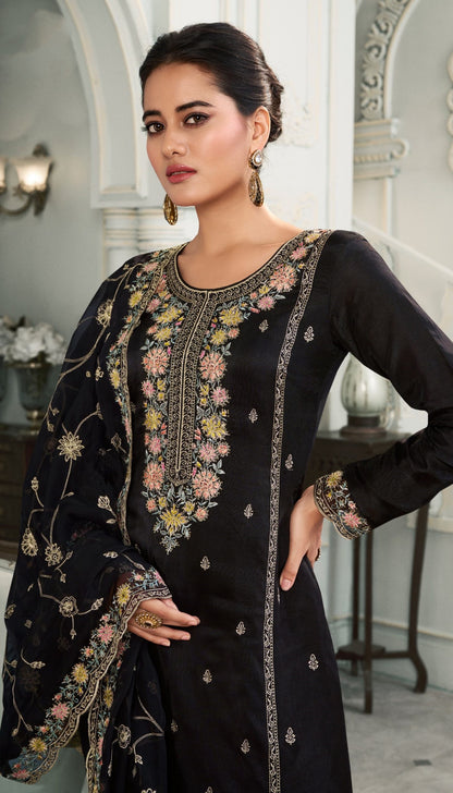 Elegant Black Salwar Suit Featuring Detailed Embroidery And Organza Dupatta For Festive Or Party Wear.