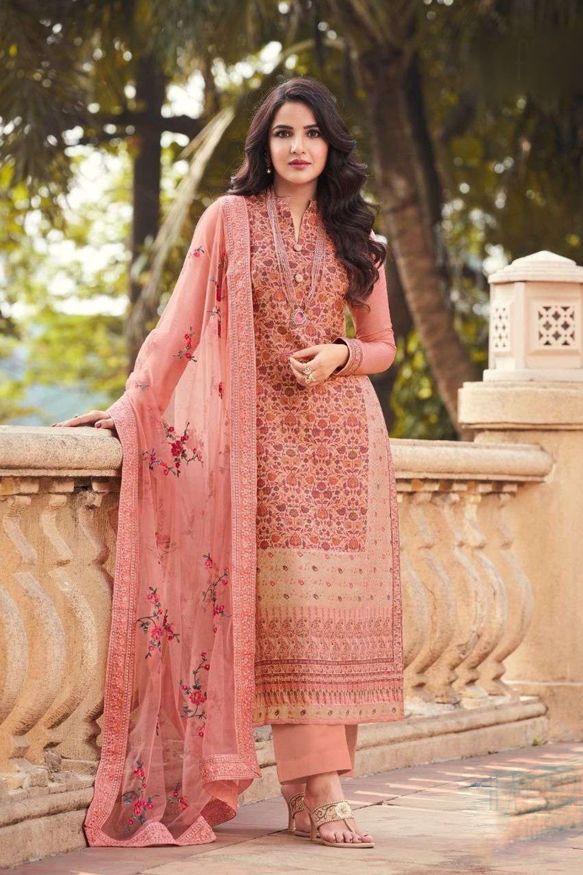 Peach embroidered salwar kameez styled for an elegant occasion