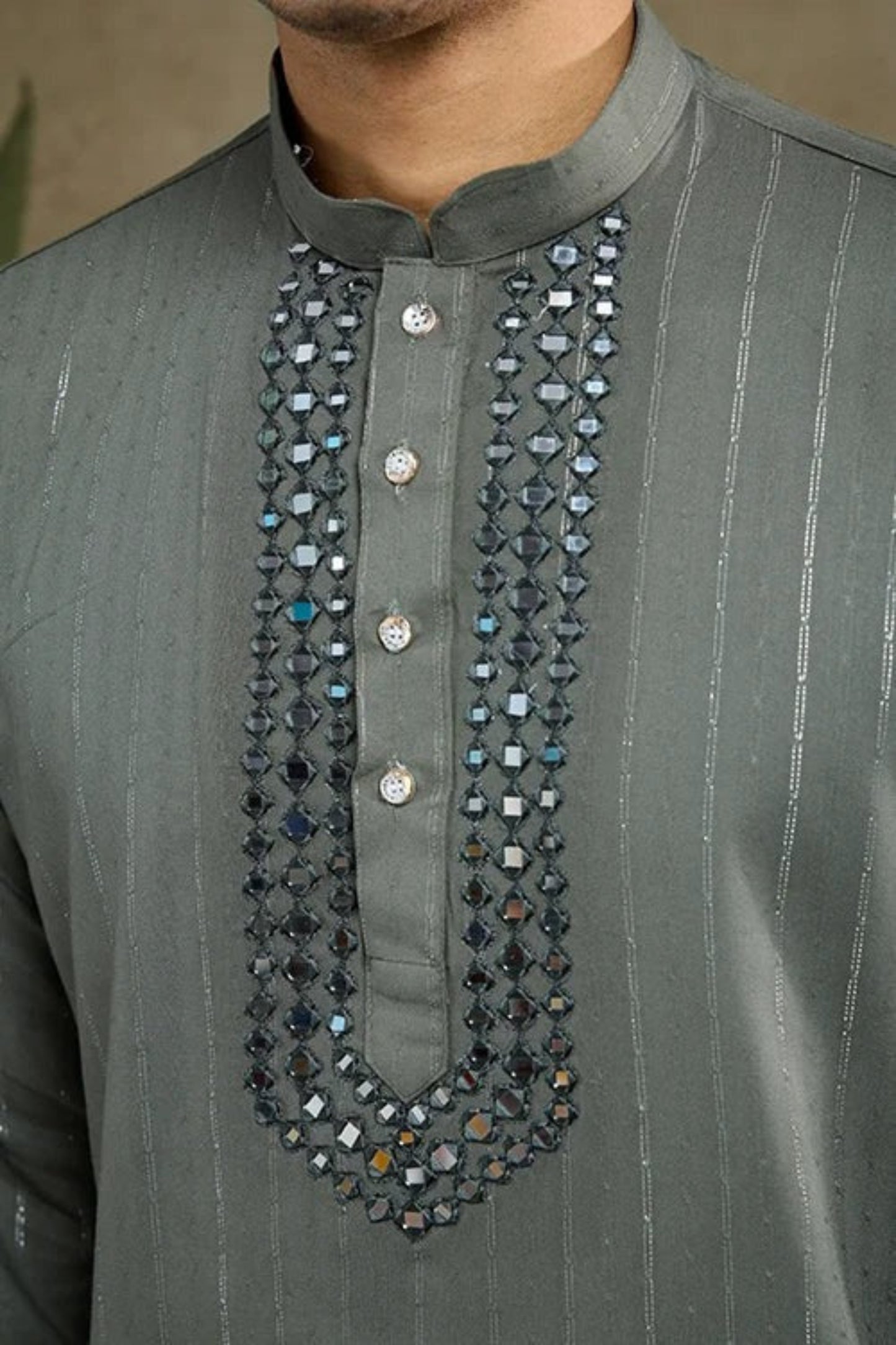 Detailed close-up of kurta pajama fabric and traditional ethnic accents