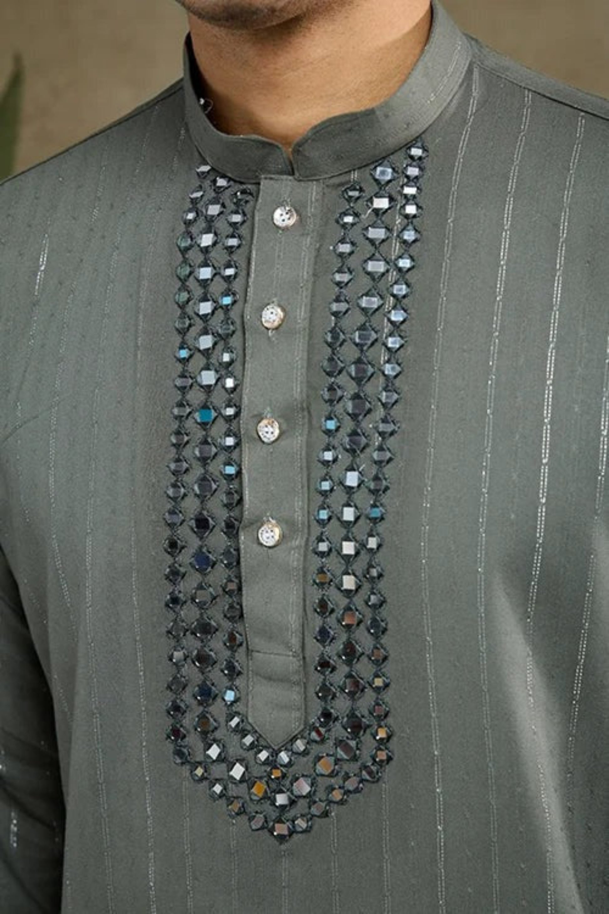 Detailed close-up of kurta pajama fabric and traditional ethnic accents