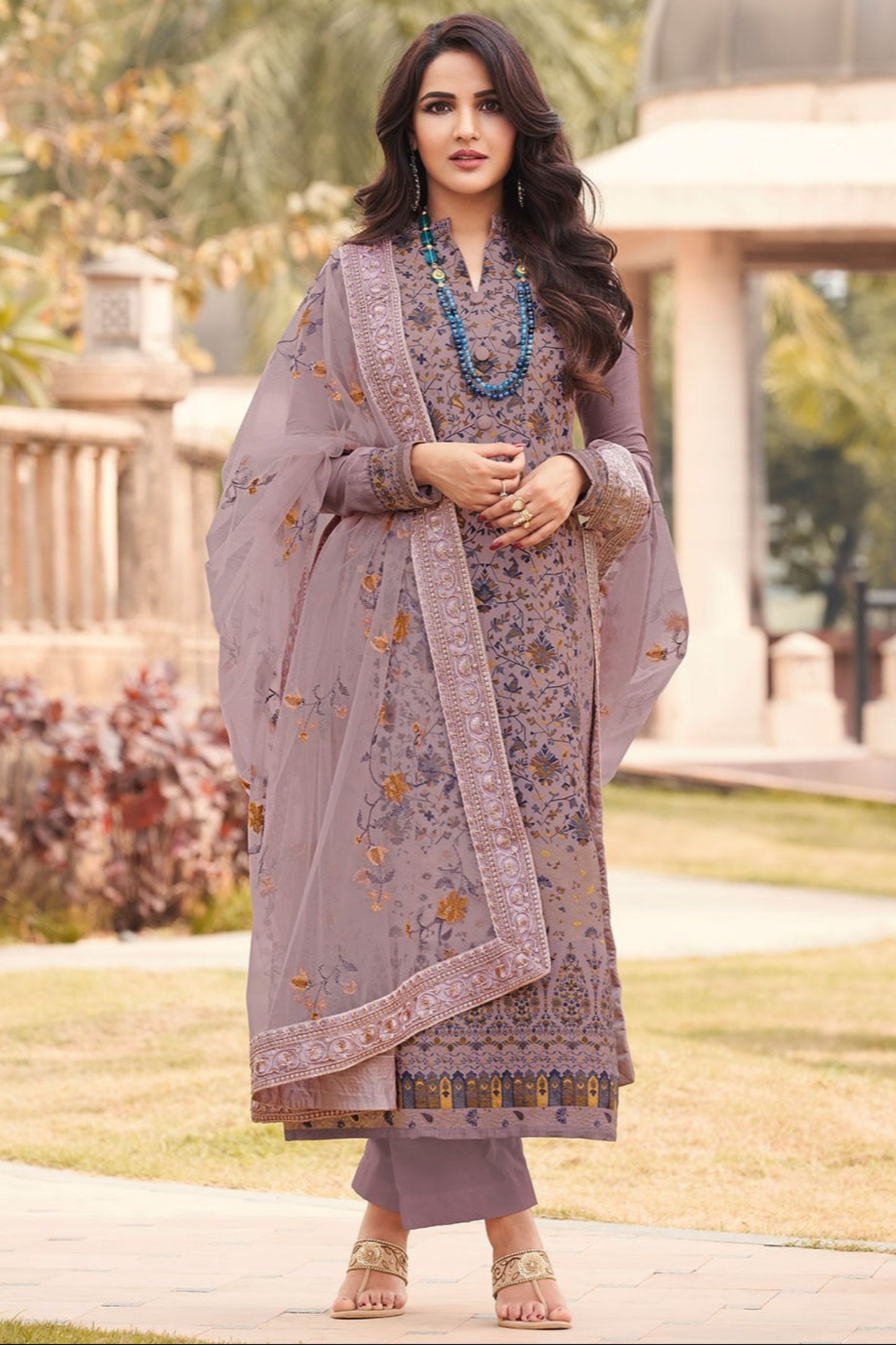 purple salwar kameez with dupatta laid flat

