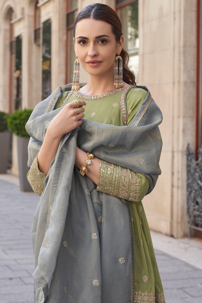 Pistachio green sharara suits with detailed embroidery work