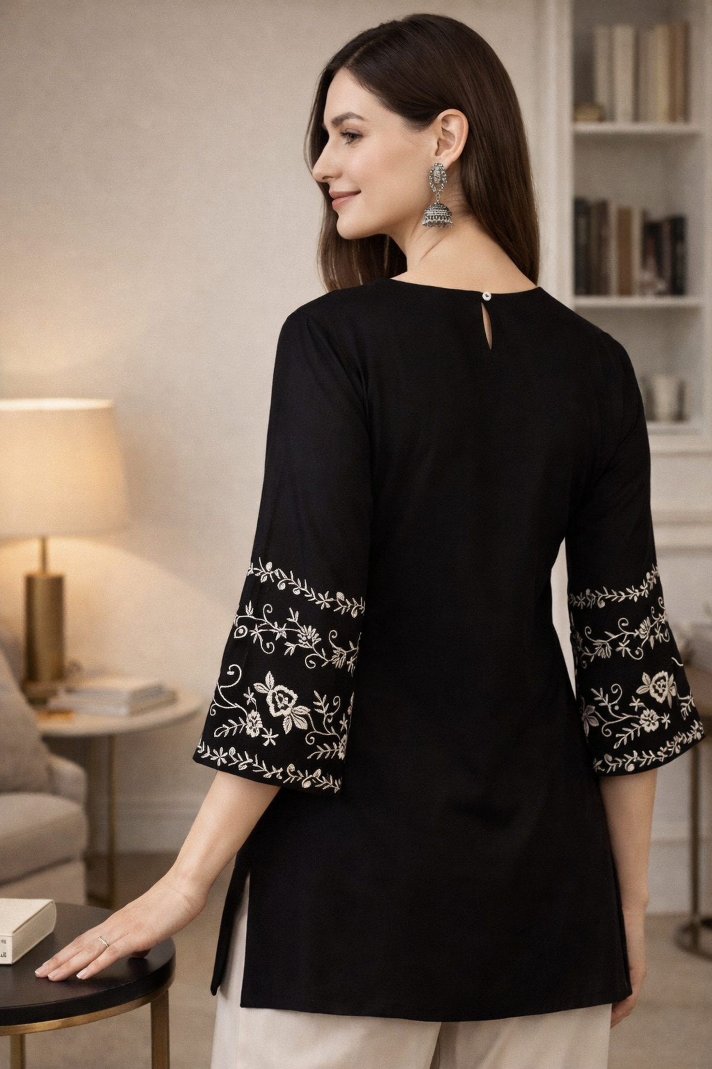Back view of black tops tunic with clean finish