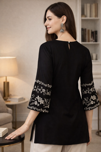 Back view of black tops tunic with clean finish