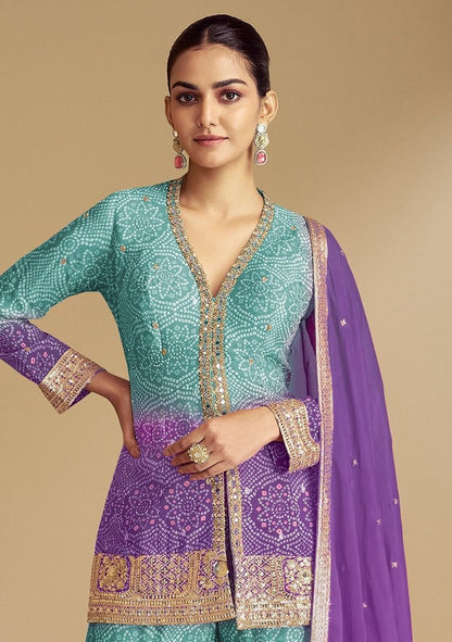 Sky blue sharara suit featuring purple embroidered accents