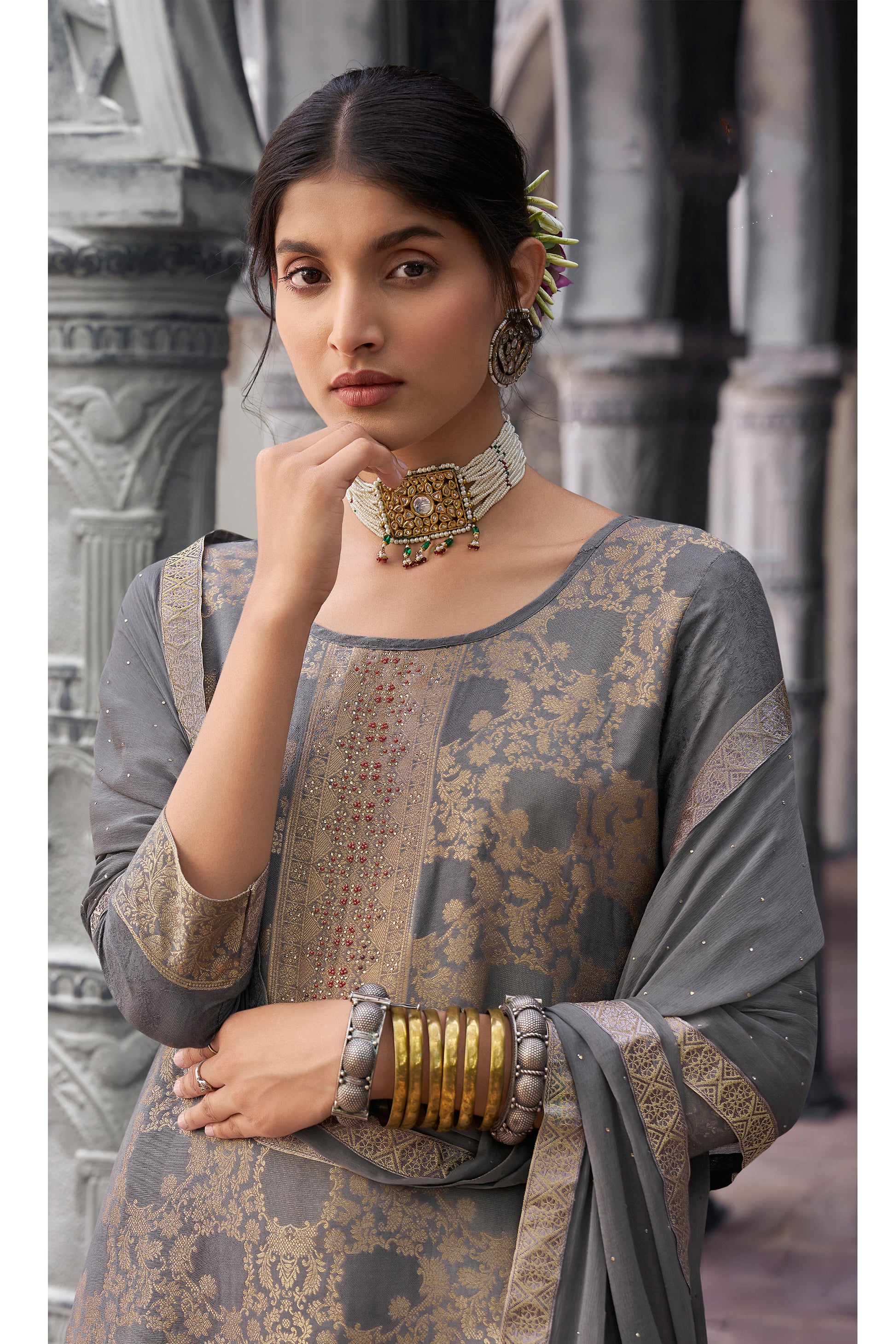 Embroidery close-up on sleeve of gray salwar suit