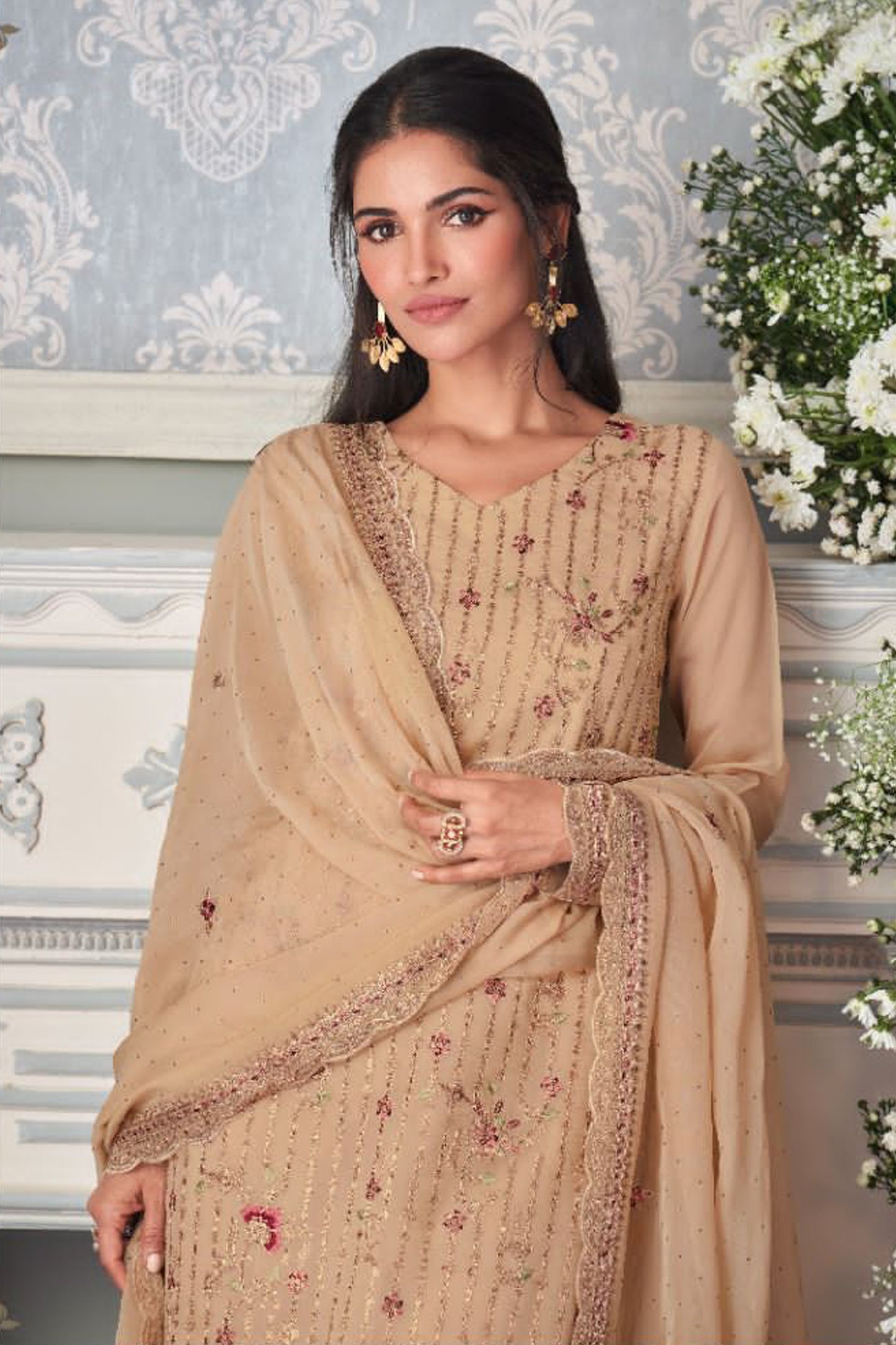 detailed embroidery work on brown Indian suit