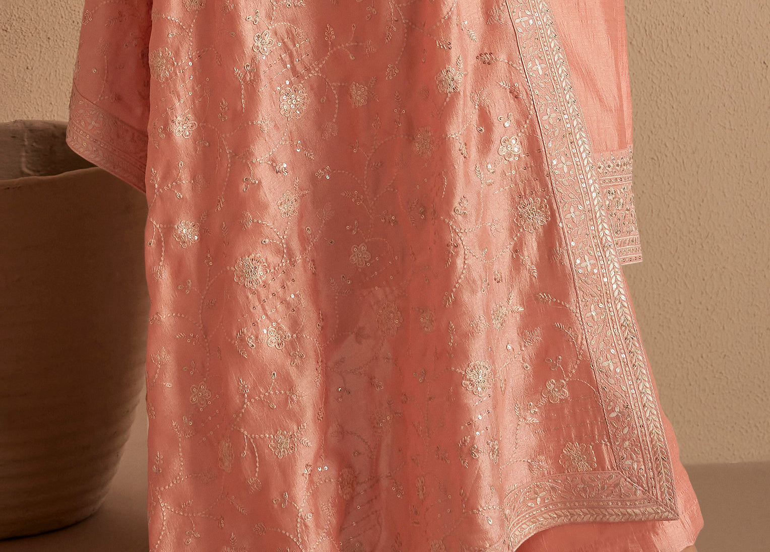 Side angle view of peach salwar kameez drape