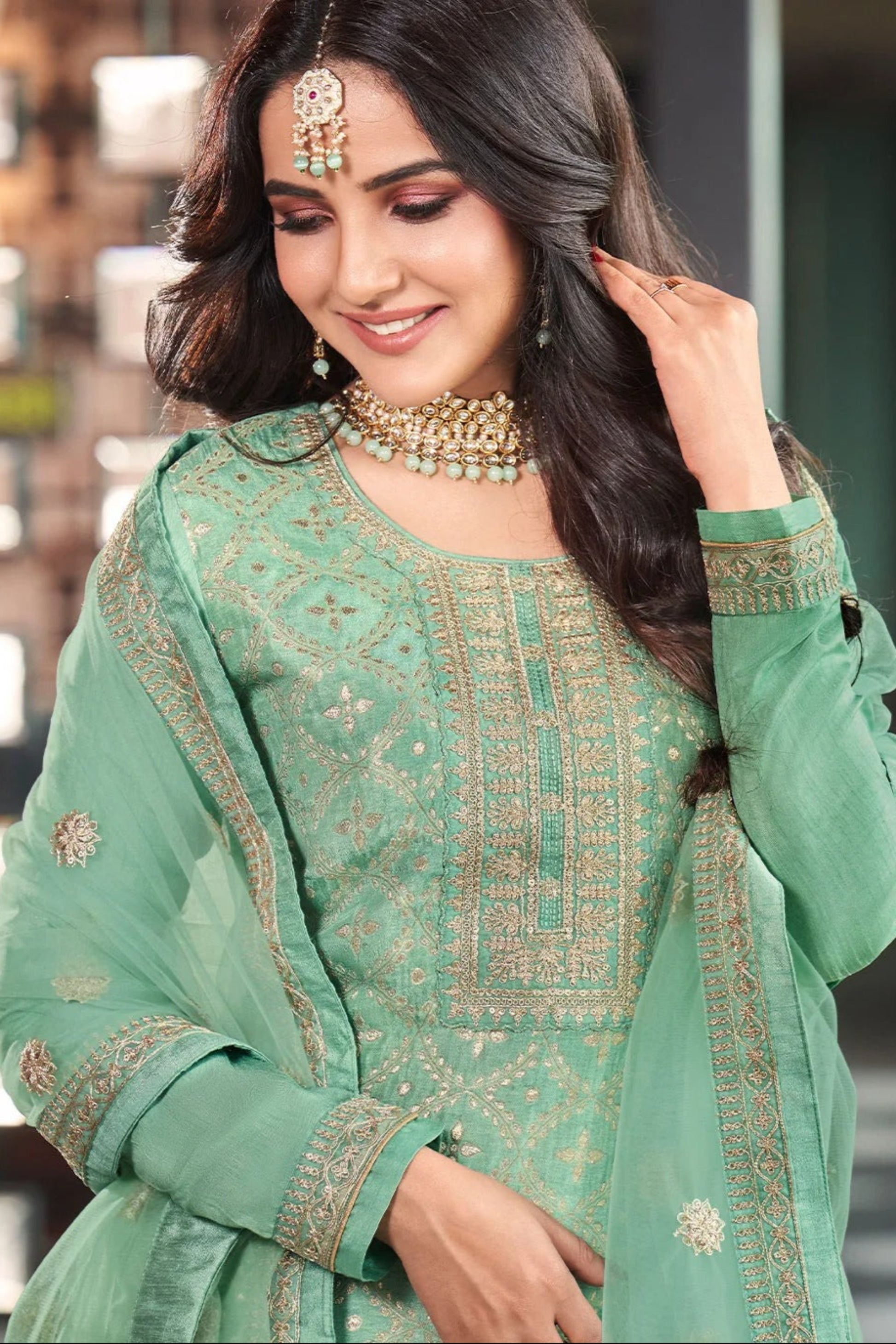 Pistachio green salwar suit embroidered detail close-up