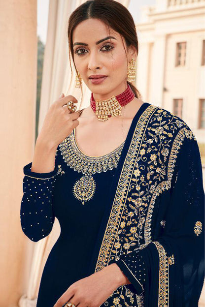 close-up of embroidery work on navy kameez
