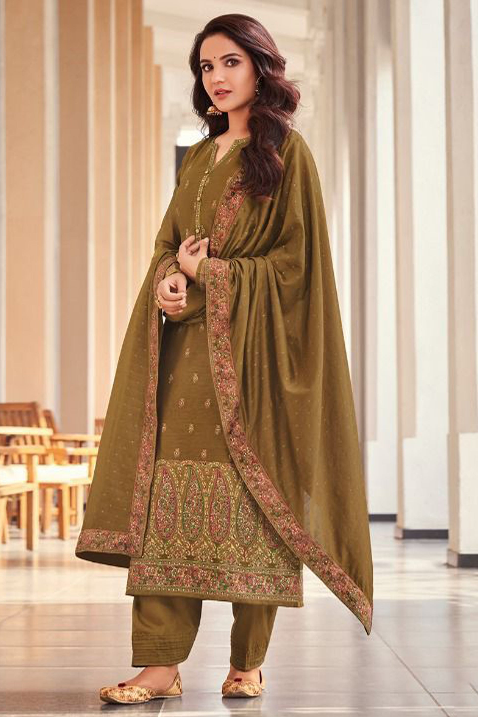 Woman wearing a traditional outfit with a patterned shalwar kameez USA wear.
