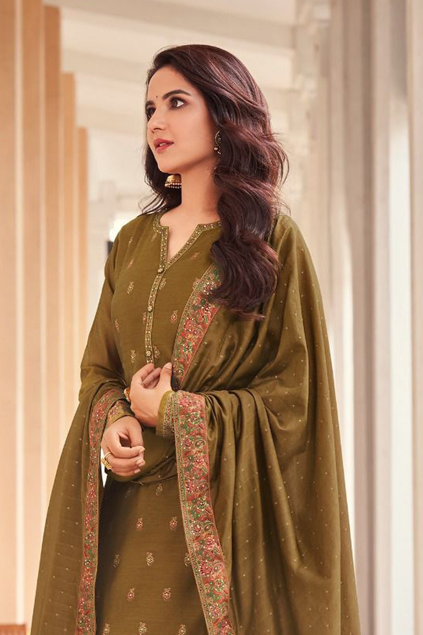 Woman wearing a traditional outfit with a patterned shalwar kameez USA wear.