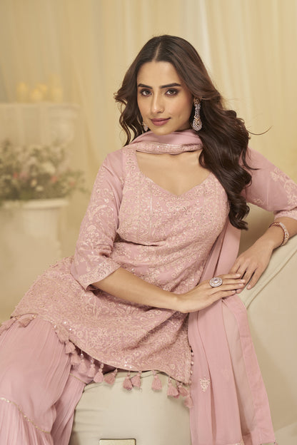 Soft georgette drape visible in peach outfit