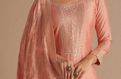 Embroidery detailing on silk peach kameez shalwar neckline