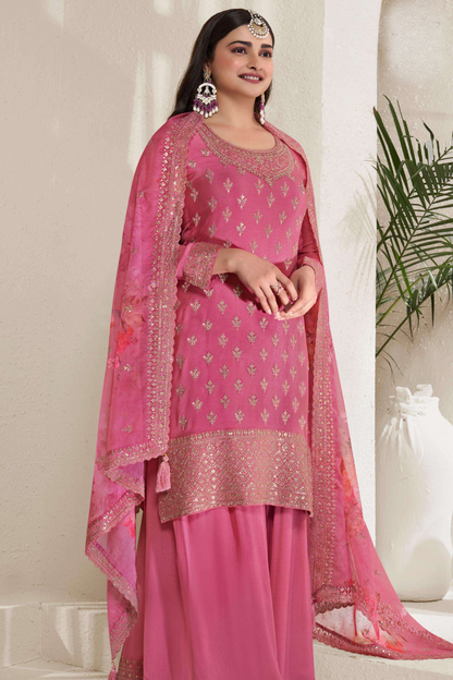 A Woman Wearing a Pink Salwar Kameez Palazzo Dupatta Dress with Embroidery Work.

