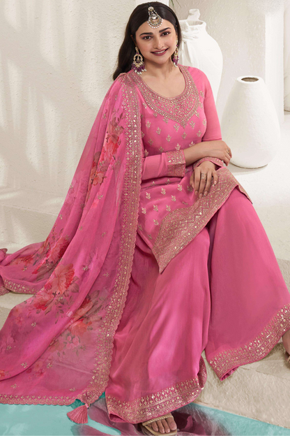 A Woman Wearing a Pink Salwar Kameez Palazzo Dupatta Dress with Embroidery Work.