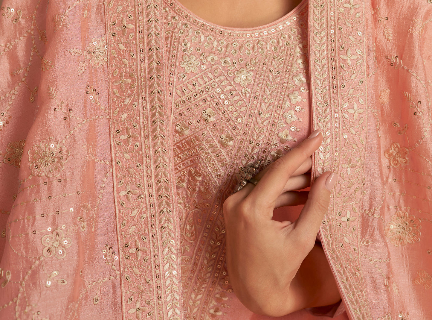 Back view of peach kameez shalwar with refined finish