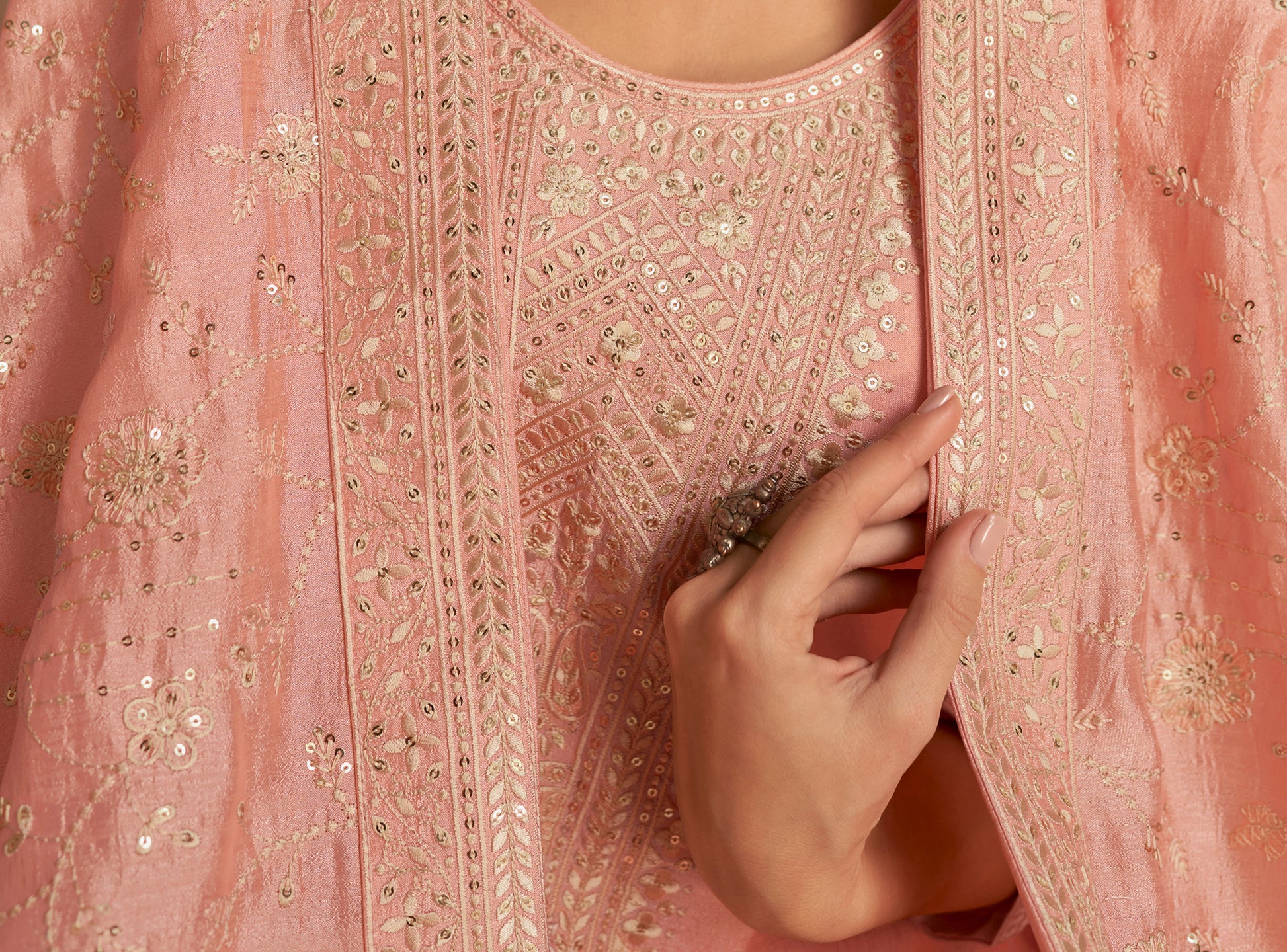 Back view of peach kameez shalwar with refined finish