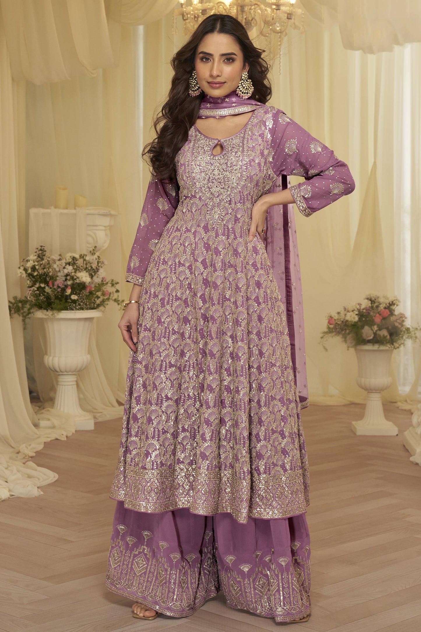 Pink festive palazzo outfit under evening lighting