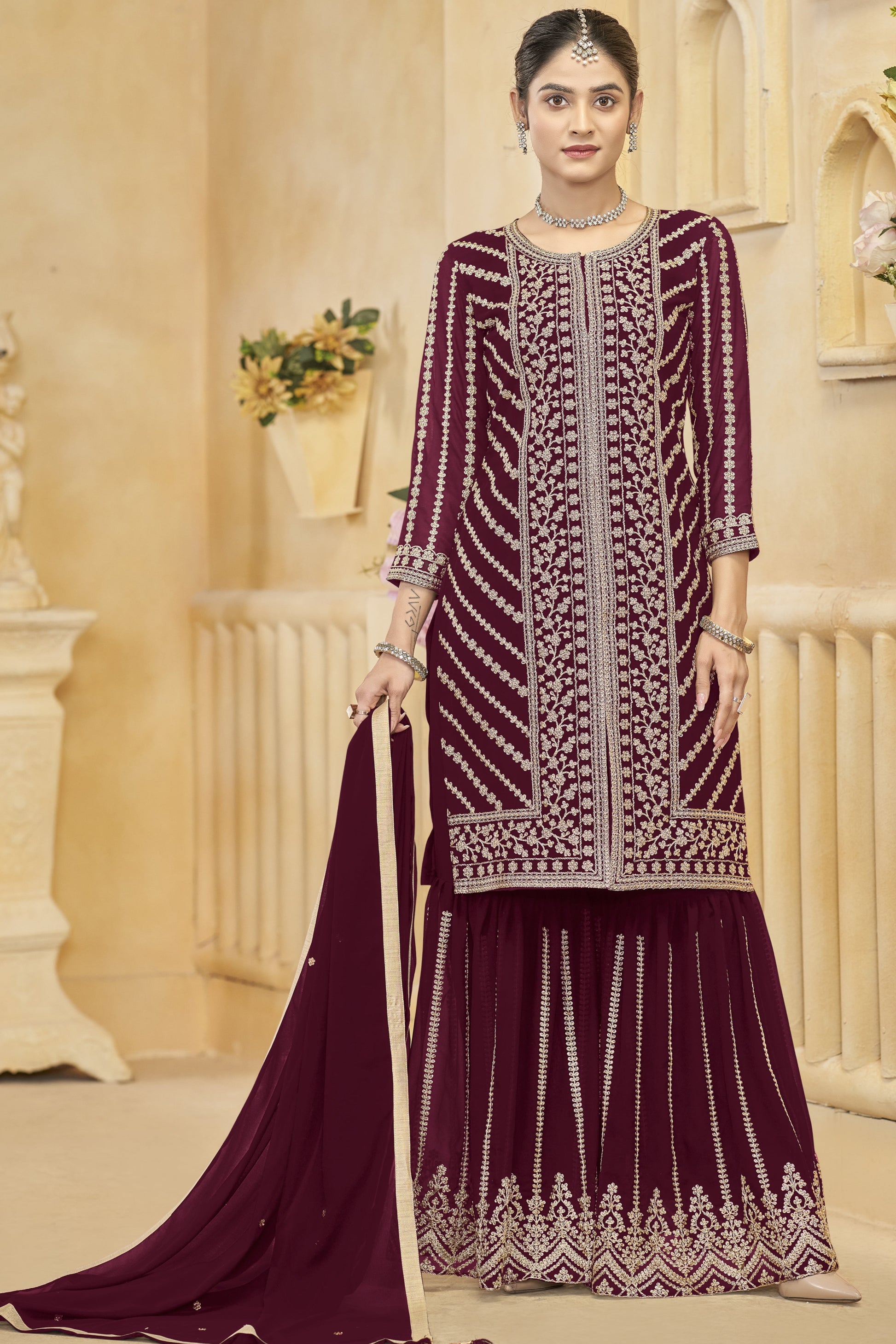 A wine-colored salwar kameez exudes elegance and sophistication