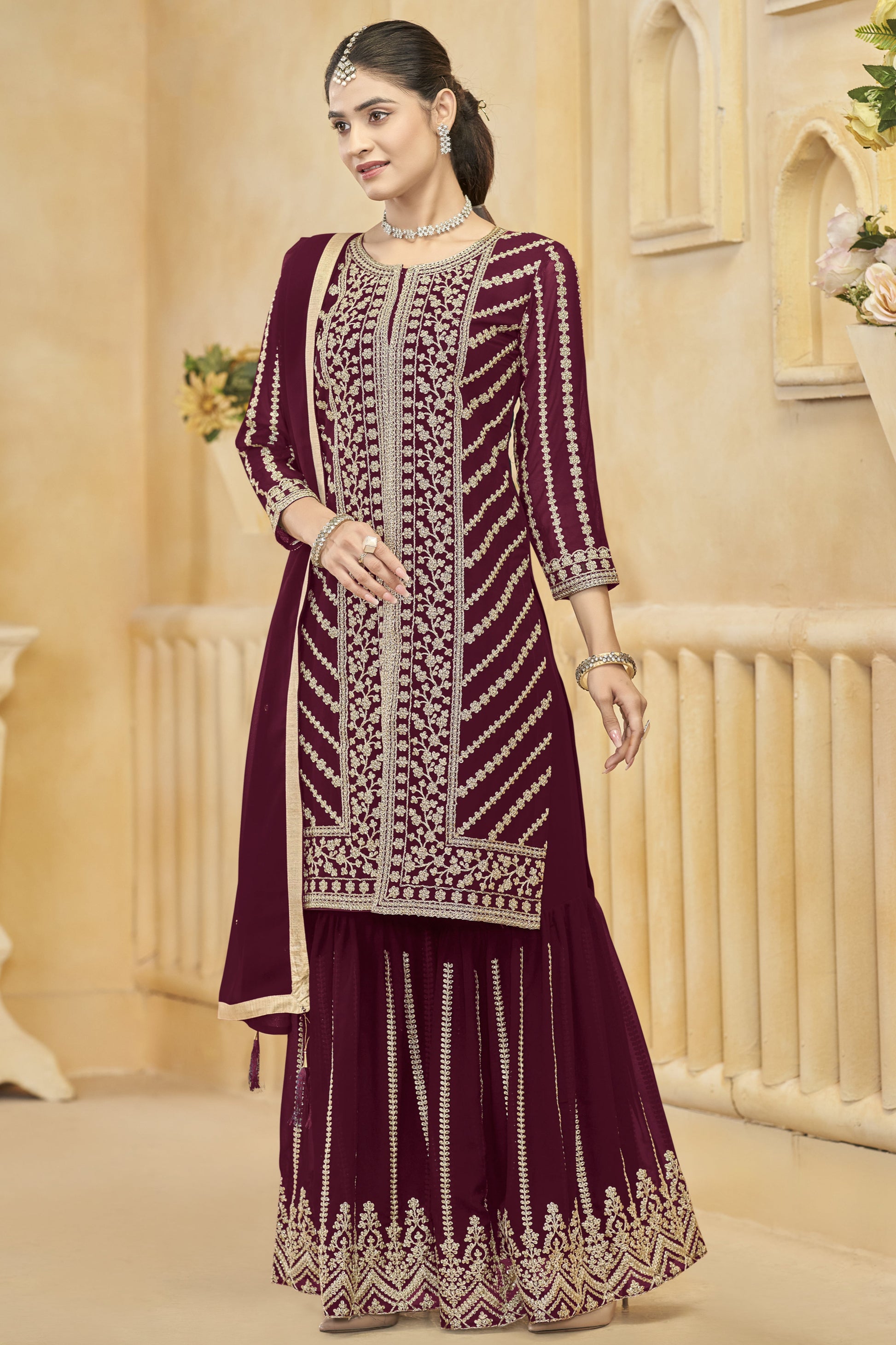 A wine-colored salwar kameez exudes elegance and sophistication