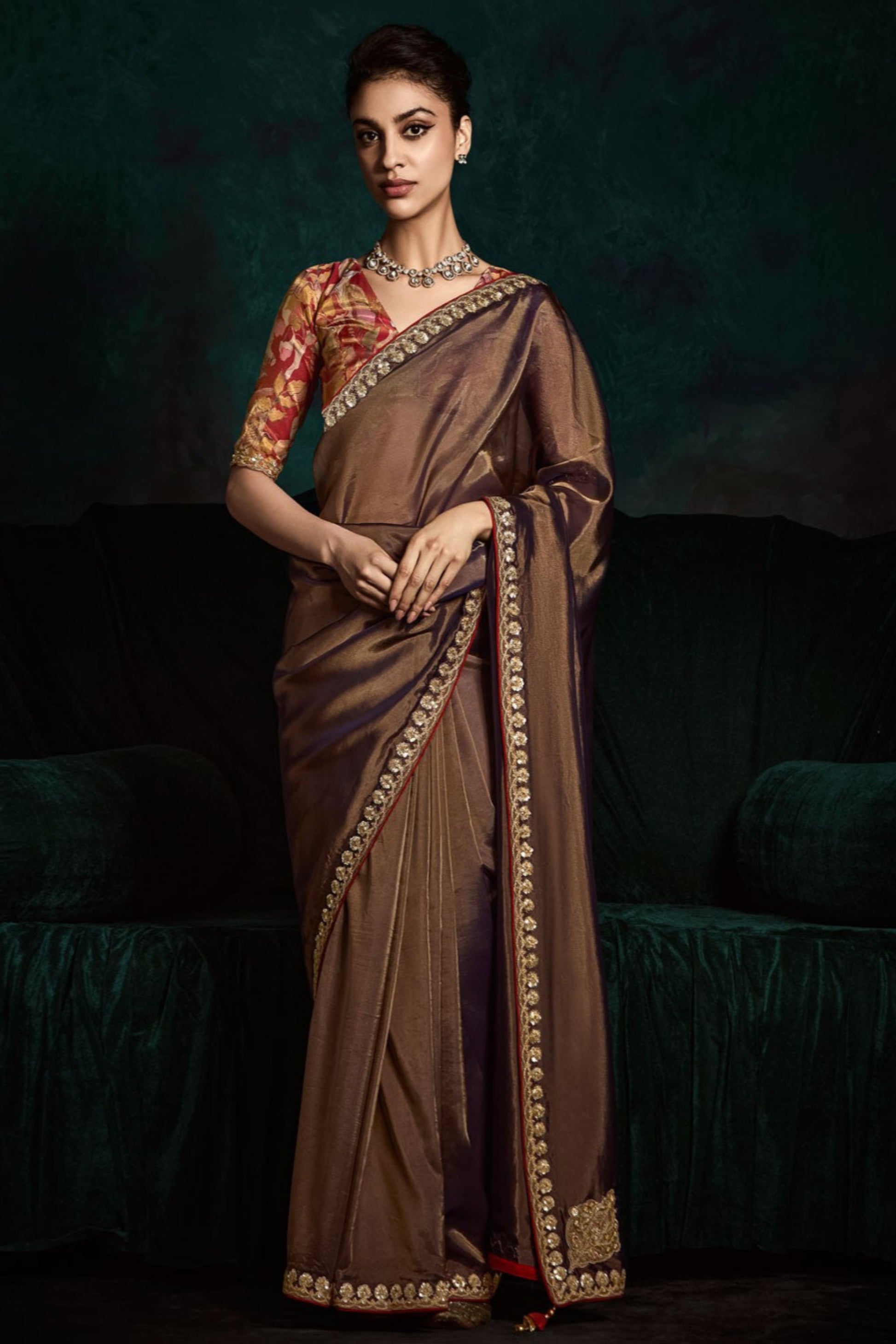 Brown Saree brings earthy elegance – ideal for intimate gatherings and cultural celebrations.
