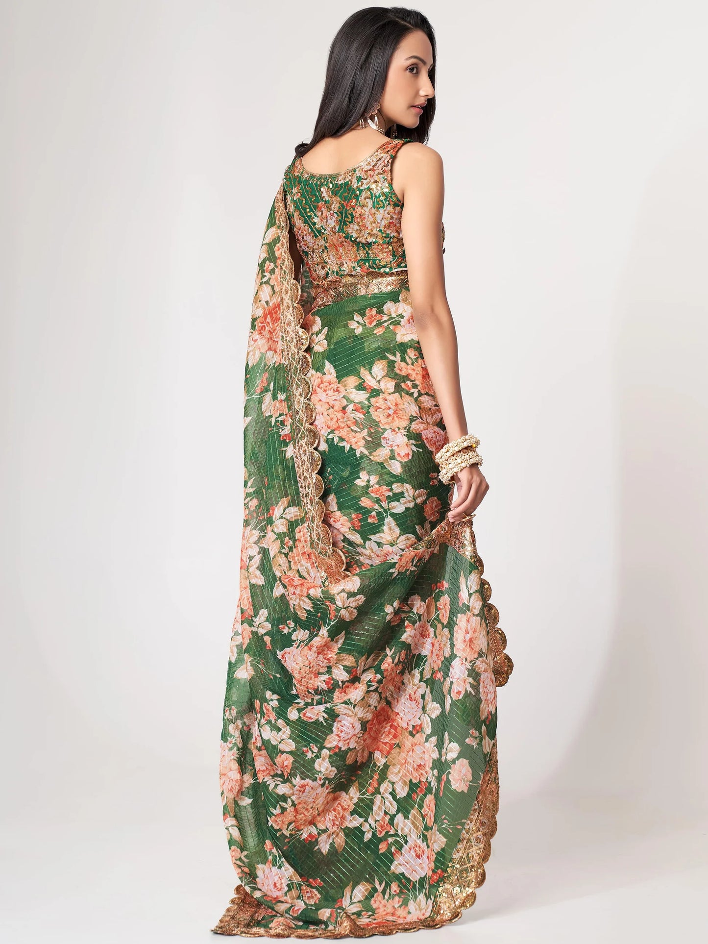 Green Saree symbolizes freshness and festivity – great for Mehndi or family gatherings.
