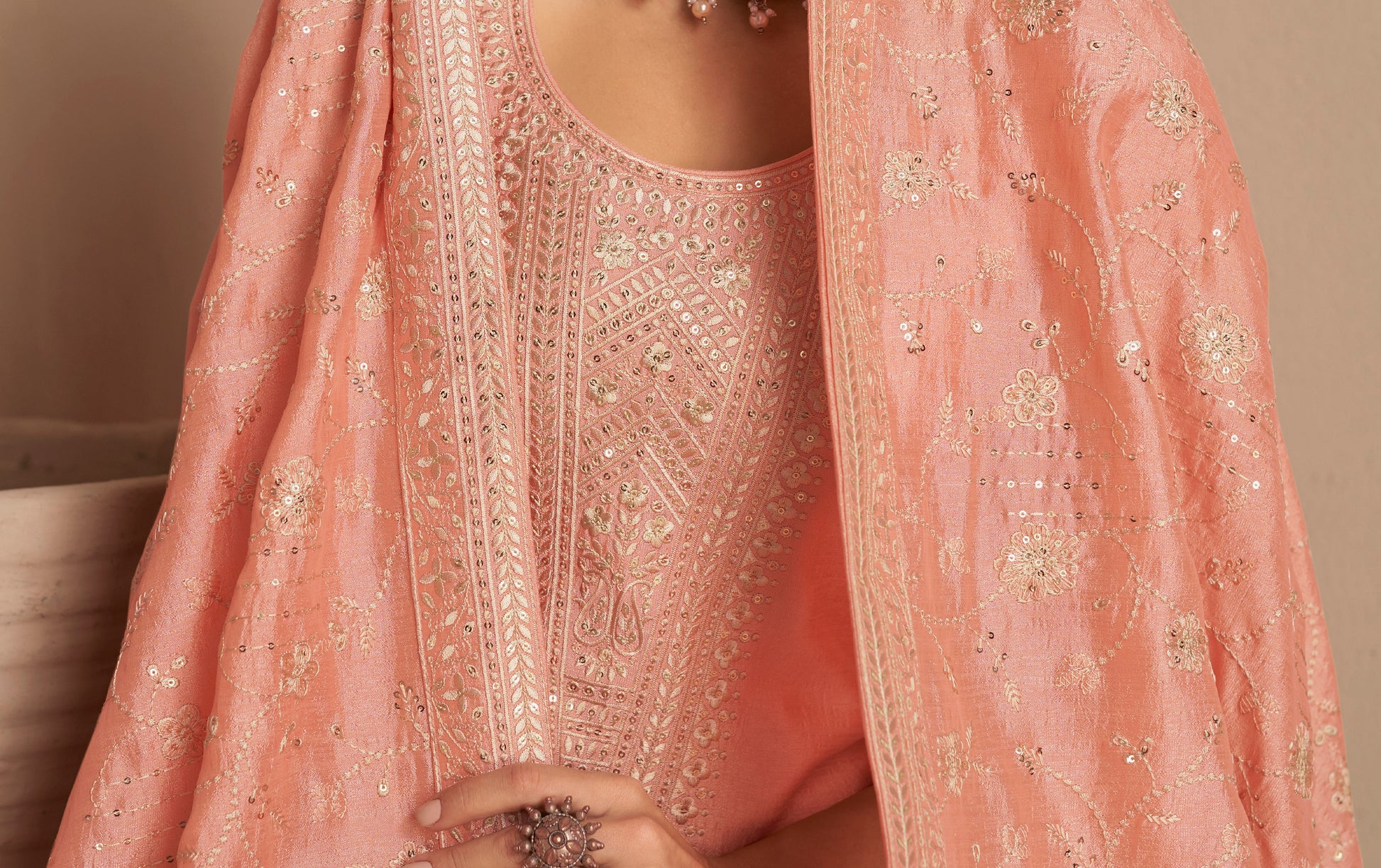 Peach kameez shalwar worn for formal evening occasion