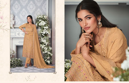 Close-up of embroidery work on light brown kameez