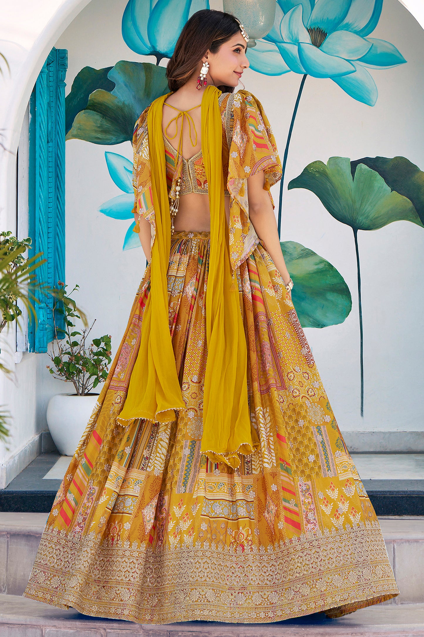 Dori and zari embroidery detail on mustard lehenga