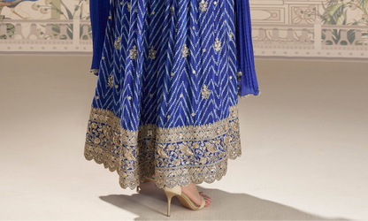 Hem detail of blue anarkali dress with design work