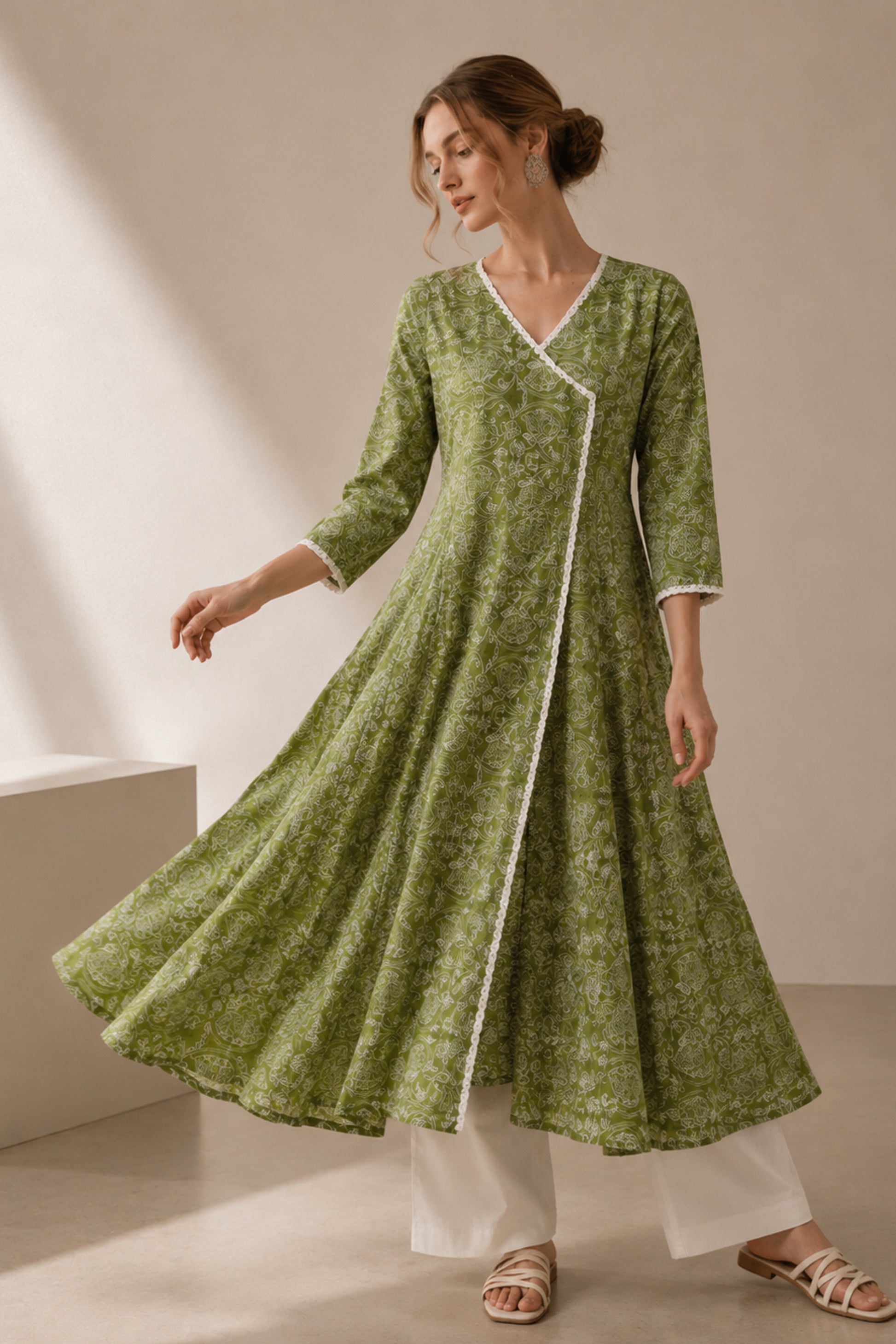Woman wearing Green Anarkali Kurti with Floral Embroidered detailing