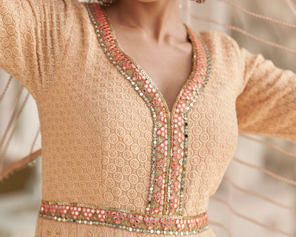 Sleeve detail of peach anarkali dress with thread work