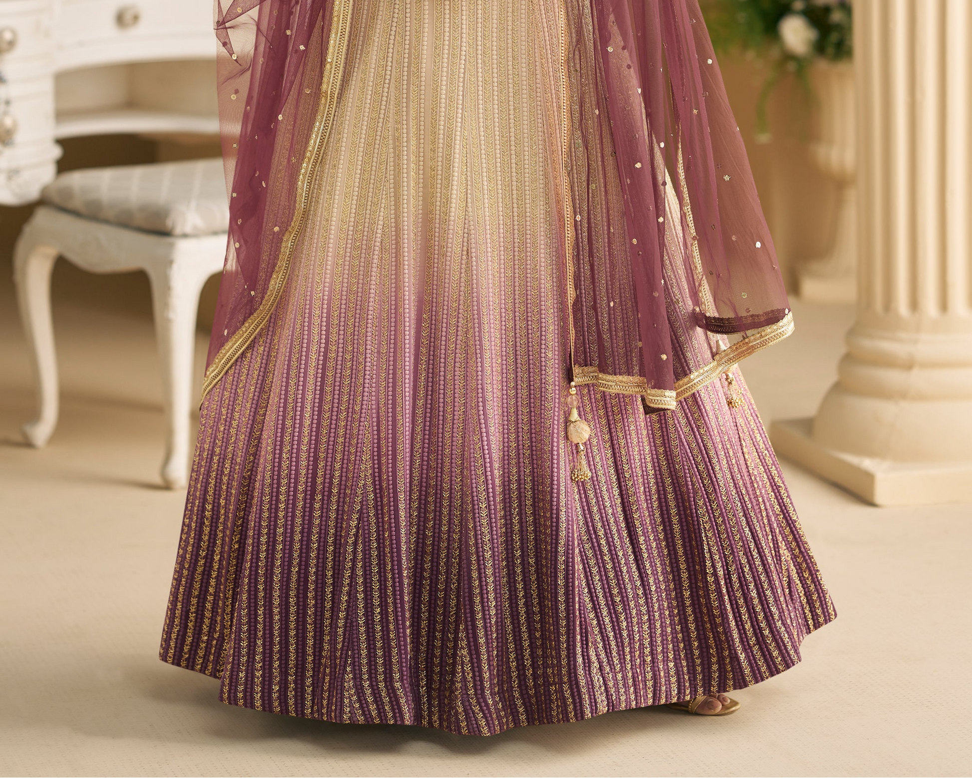 Hem detail of flared wine anarkali dress